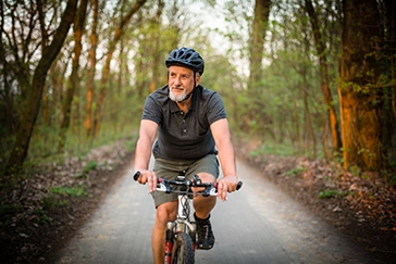 Image of man riding bike Image of senior man riding bike